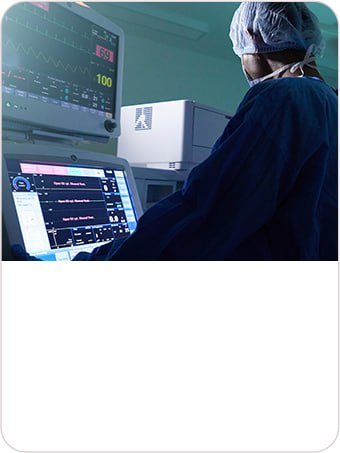Anesthesiologist monitoring a patient’s vital signs during surgery